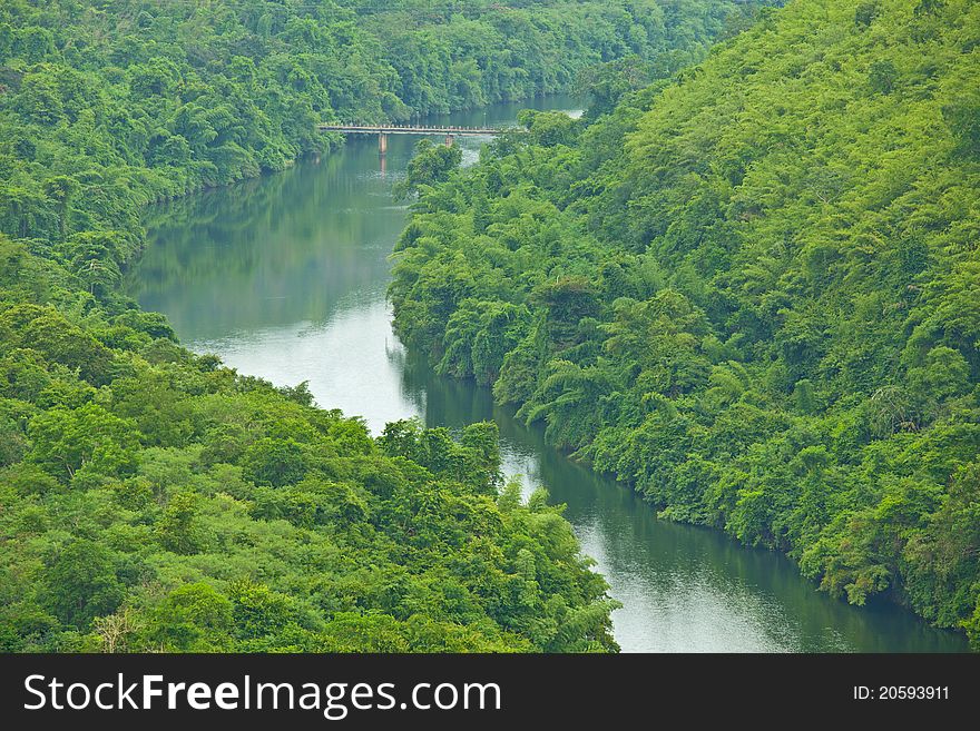 Bridge to the jungle mountain and river in Thailand