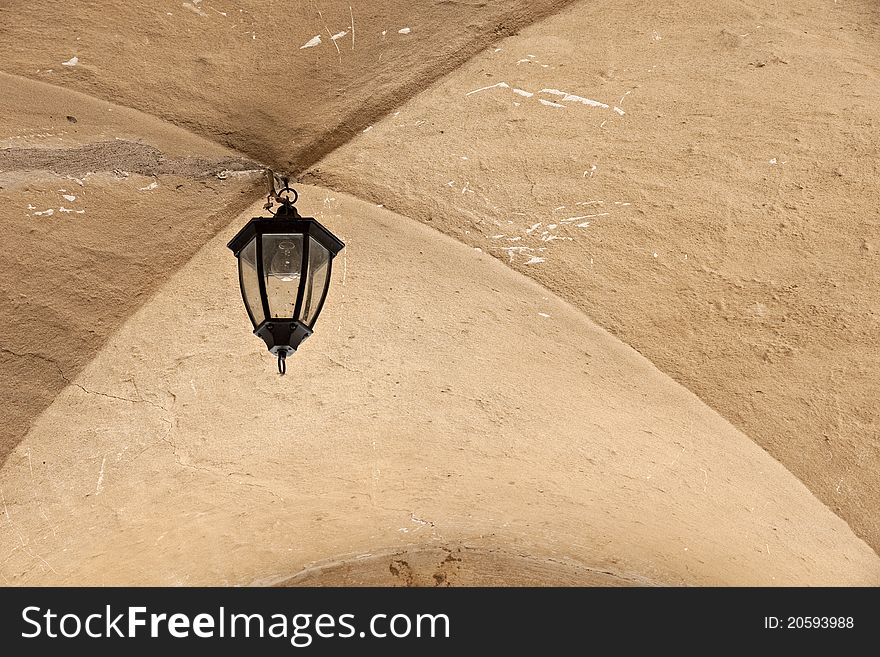 Old lantern in archway in medieval castle. Jaunpils.Latvia. Old lantern in archway in medieval castle. Jaunpils.Latvia.