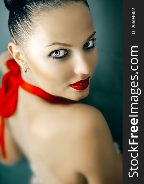 Close-up portrait of beautiful woman's purity face with bright red lips. Close-up portrait of beautiful woman's purity face with bright red lips