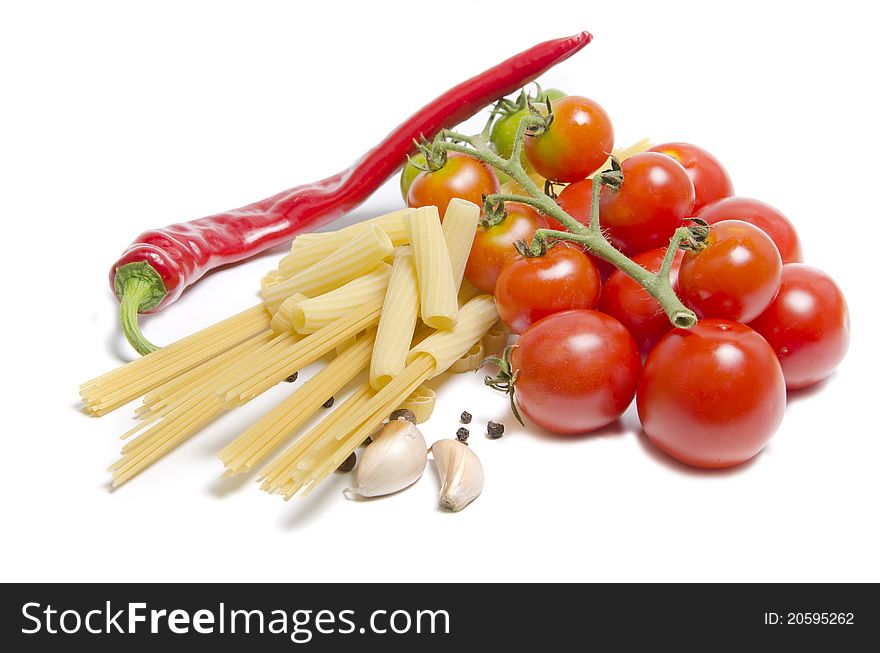 Tomatoes and pasta with spice on white background