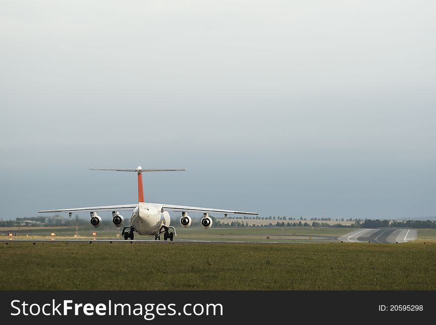 Airplane on begin runway is waiting for take off, Prague Ruzyne Airport.
