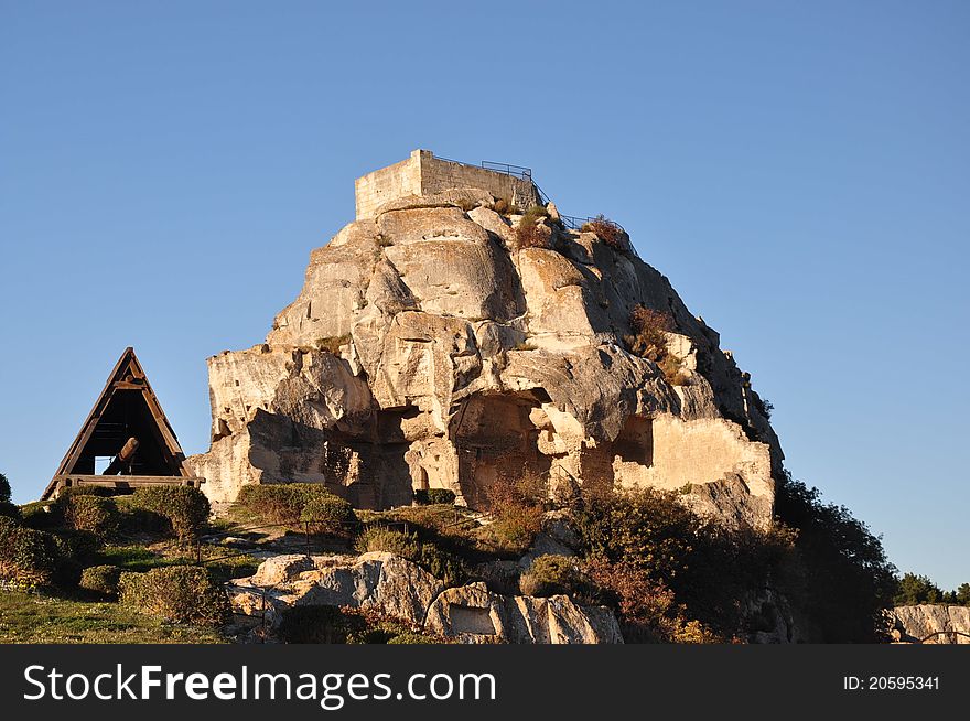 A medieval village with a ruined castle set on a hilltop in the Alpilles mountains. A medieval village with a ruined castle set on a hilltop in the Alpilles mountains
