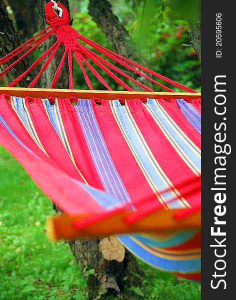 A hammock in the garden at the summer day