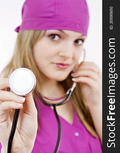 Beautiful nurse with stethoscope in her hand