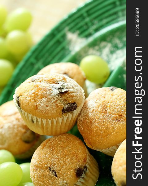 Muffins With Chocolate On Green Plate