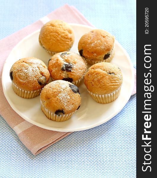 Muffin with chocolate on plate