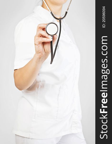 Young Doctor in uniform with stethoscope. Young Doctor in uniform with stethoscope