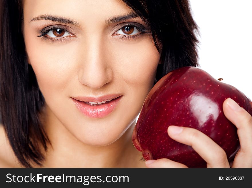 Portrait of beautiful female holding red apple, looking at camera. Portrait of beautiful female holding red apple, looking at camera