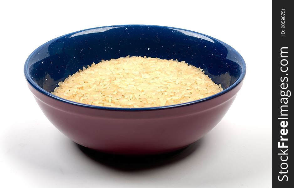 Studio shot of bowl of rice on white background