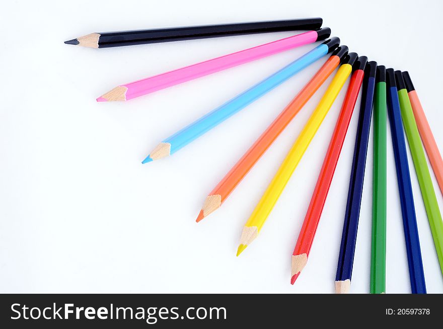 Colored pencils for children isolated on white background