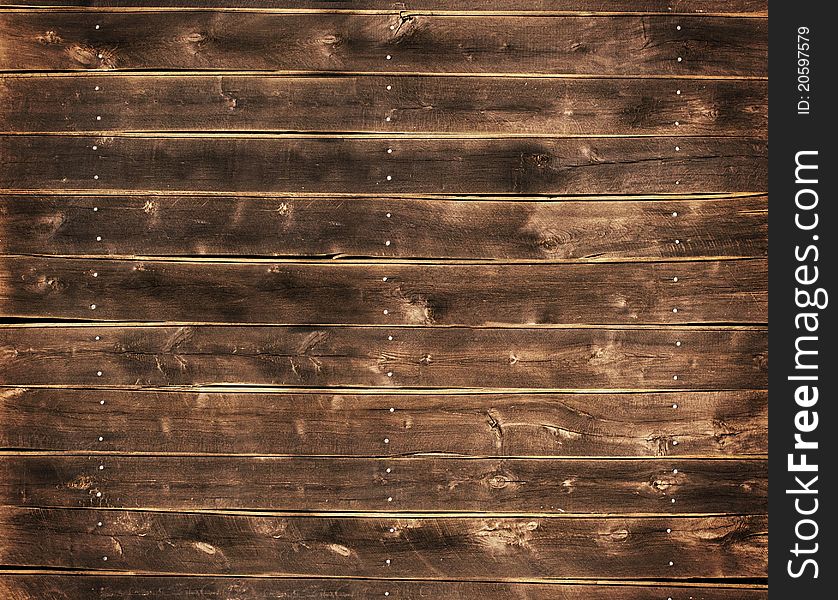 Close up of a wood fence with nails. Close up of a wood fence with nails