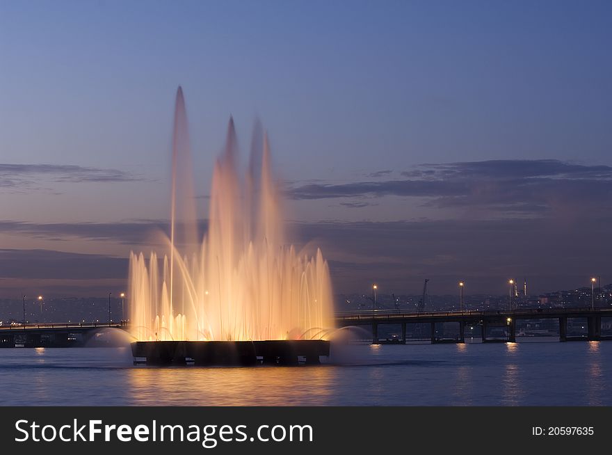 A fountain in the Golden Horn, behind the Unkapani Bridge. Istanbul-Turkey. A fountain in the Golden Horn, behind the Unkapani Bridge. Istanbul-Turkey