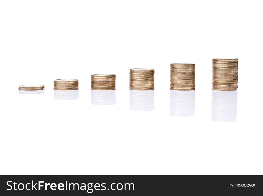 Stacks of coins like diagram with reflection against a white background