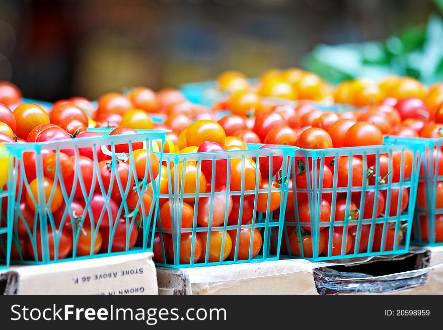 Baskets of red and yellow cherry tomatoes. Baskets of red and yellow cherry tomatoes.