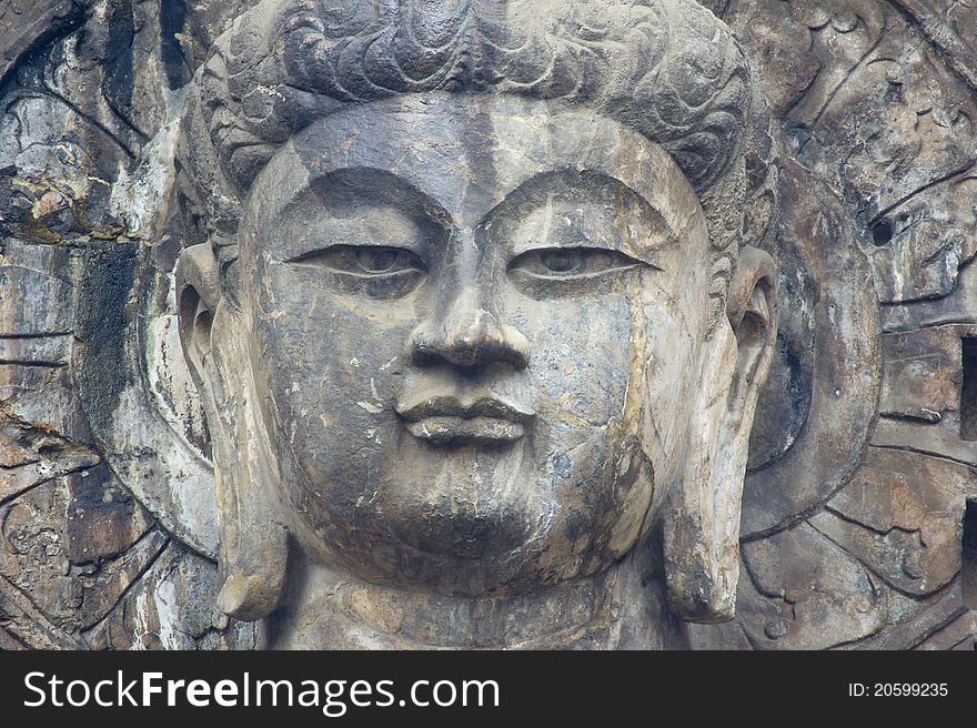 Closeup shot of a Buddha at Longmen Grottoes, Luoyang, China. Closeup shot of a Buddha at Longmen Grottoes, Luoyang, China