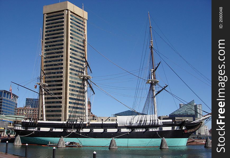 Revolutionary ship docked in a harbor and repainted.