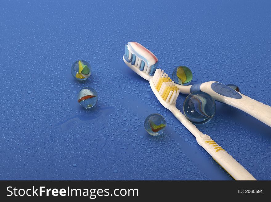 Tooth brushes on a blue background. Tooth brushes on a blue background