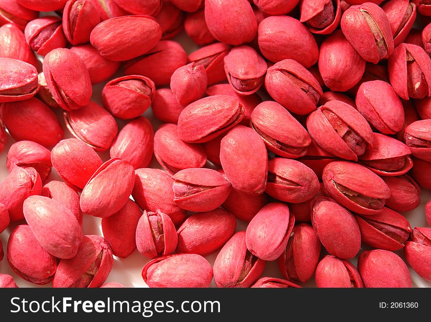 Red pistachios on a white background