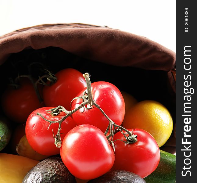 Large basket filled with various vegetables. Large basket filled with various vegetables.