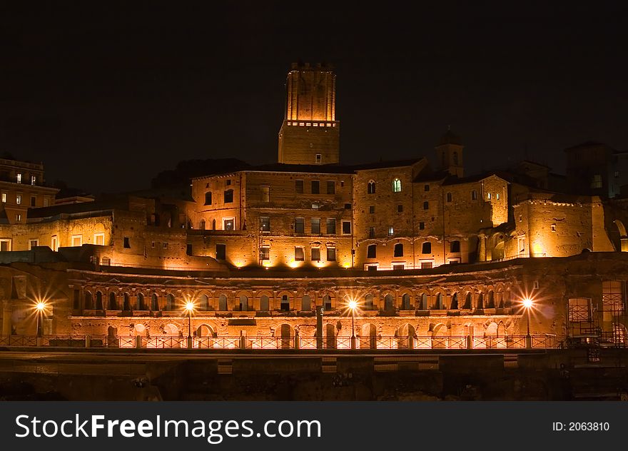 Red stone building - Trajan forum in Rome, Italy by night