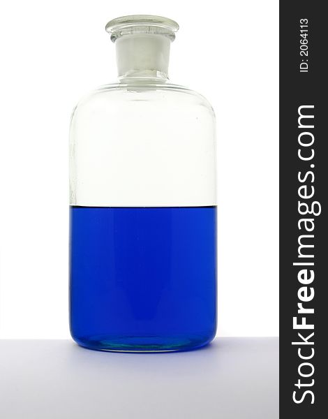 Laboratory bottle with blue liguid on the white background. Laboratory bottle with blue liguid on the white background