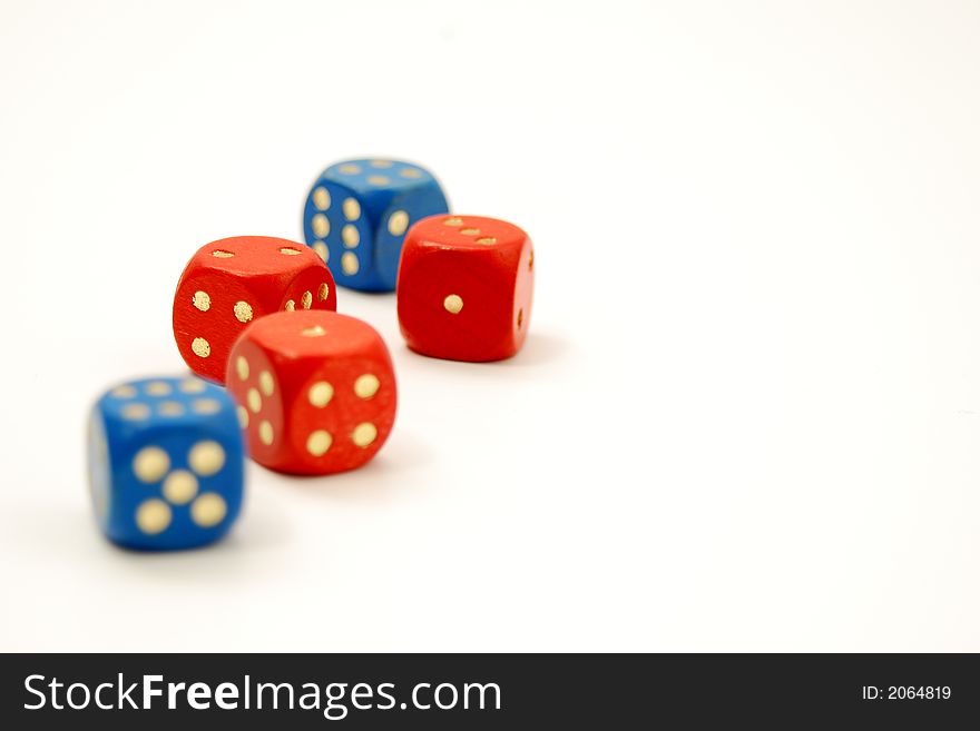 Blue and red dice on a white table. Blue and red dice on a white table