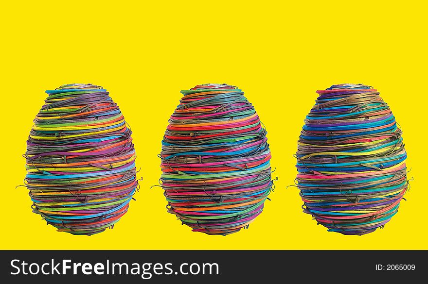 Three eggs on yellow background