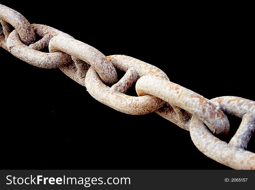Old rusty chain over black