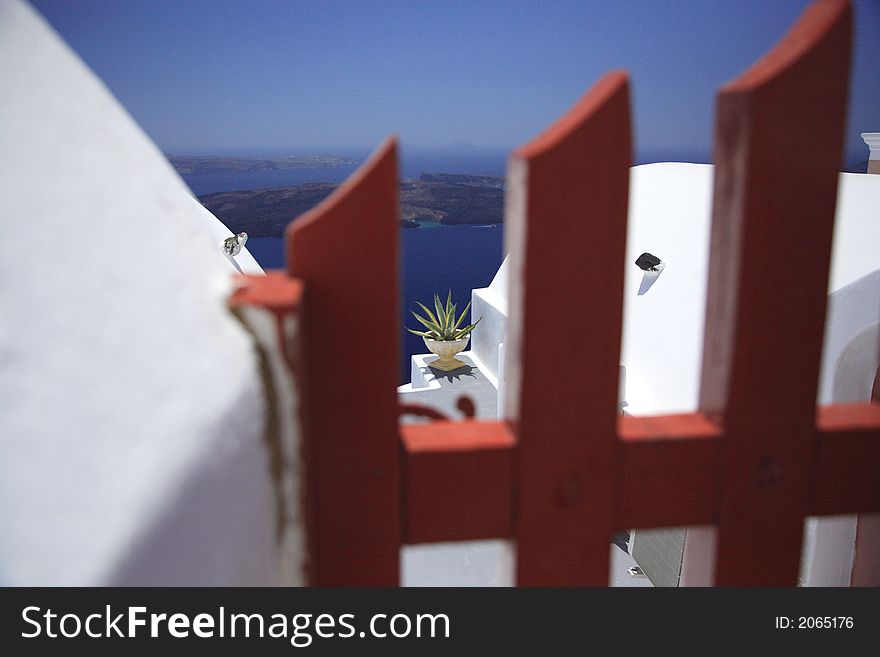 View of Caldera through a gate Santorini Greece