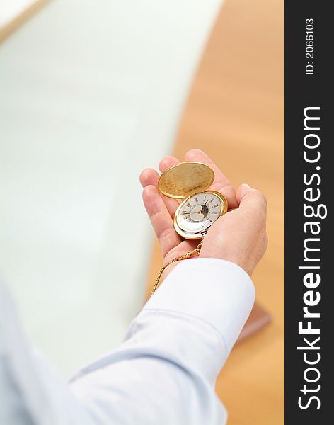 Business man with golden clock. Business man with golden clock