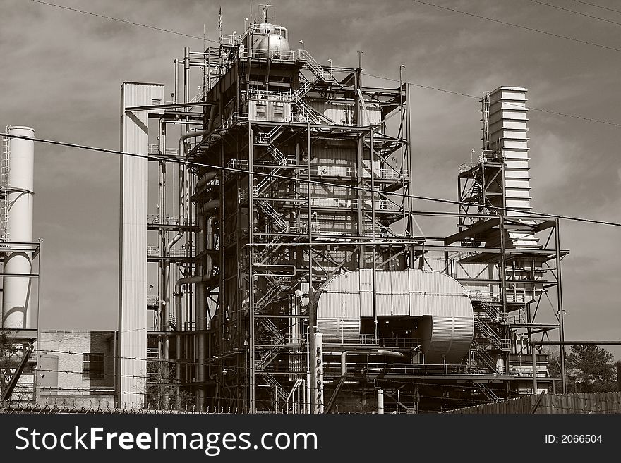 Bleak, black & white image of a 1950's era oil-fired electrical power plant. Bleak, black & white image of a 1950's era oil-fired electrical power plant.