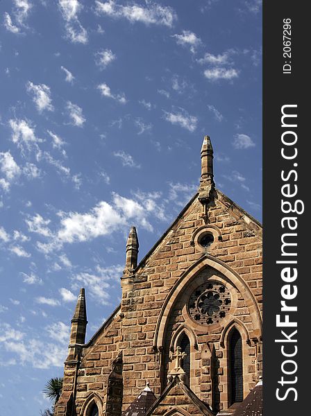 Old Stone Church Building Roof, Blue Sky With White Clouds, Sydney, Australia. Old Stone Church Building Roof, Blue Sky With White Clouds, Sydney, Australia