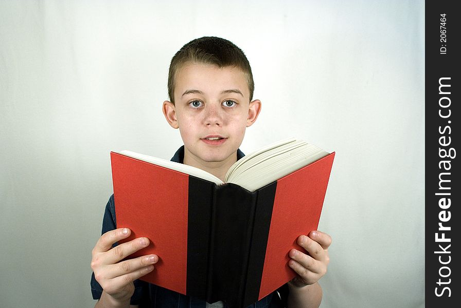 Teen Boy Smiles Reading Book