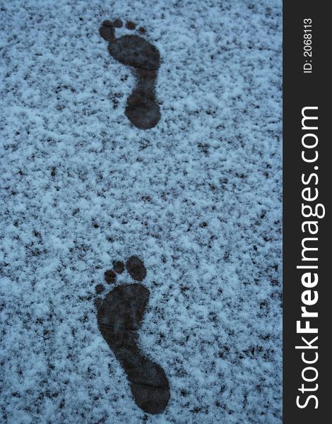 Footprints melting away in a new fallen snow. Footprints melting away in a new fallen snow