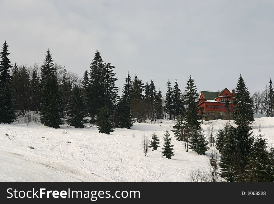 Mountain Hut in Winter Snow