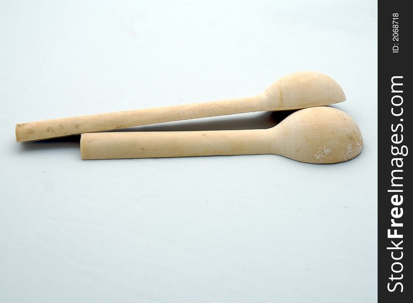 Two wooden spoon on a white background. Two wooden spoon on a white background