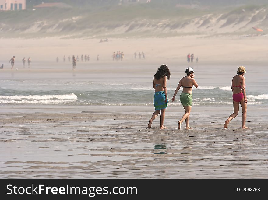 People Walking In The Beach