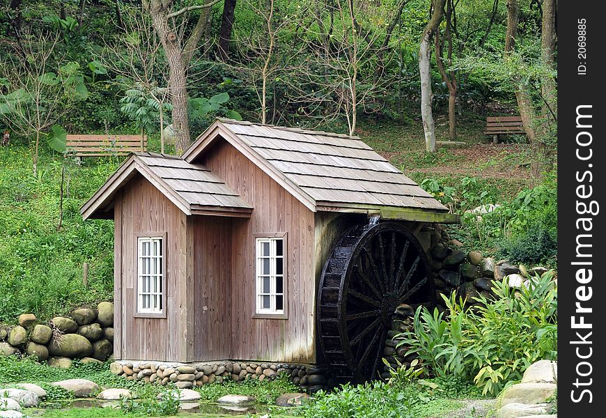 Water mill in the park. Water mill in the park.