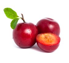 Two Fresh Plums And A Half With Leafs Royalty Free Stock Photo Two Fresh Plums And A Half With Leafs Royalty Free Stock Photo