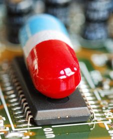 A Pill On A Computer Chip Stock Images