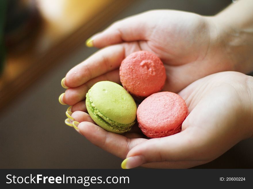 Multi Colored macaroon in the hands