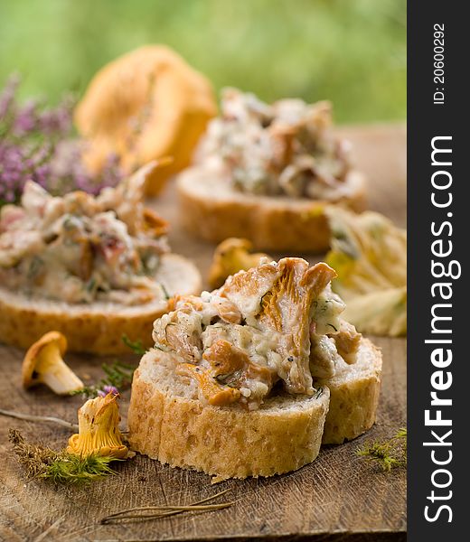 Bread with chanterelles and garlic for appetizer. Selective focus