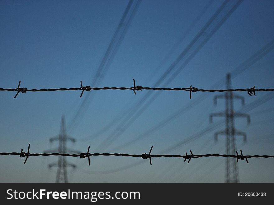 Barbed wires with high voltage. Barbed wires with high voltage