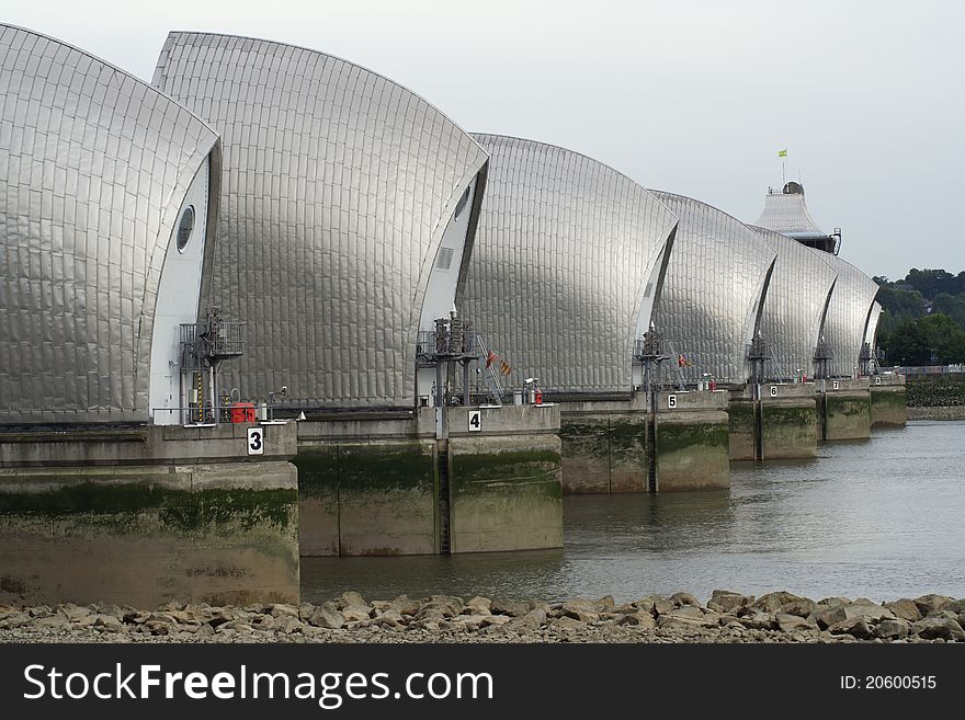 Cose up of the iconic architectural landmark for Docklands and the Thames silently protecting London from high water flooding. Cose up of the iconic architectural landmark for Docklands and the Thames silently protecting London from high water flooding