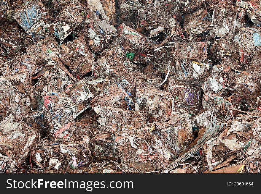 Stack of waste before shredding at recycling yunkyard. Stack of waste before shredding at recycling yunkyard