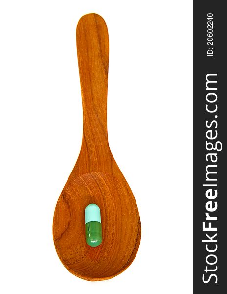 Wooden Spoon With Capsule  Isolated