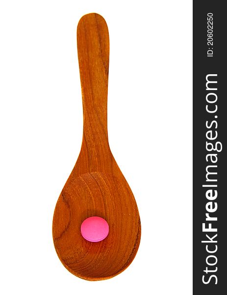 Wooden Spoon With Pill Isolated