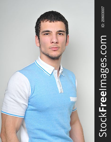 Young male model in blue polo