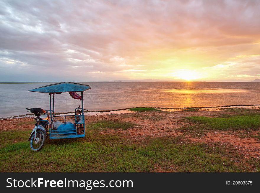 The very old bike on the sunset background at the lake back. The very old bike on the sunset background at the lake back.