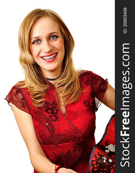 Young smiling woman in red dress holding red fan with cherry tree painted on it. All in china style. Young smiling woman in red dress holding red fan with cherry tree painted on it. All in china style